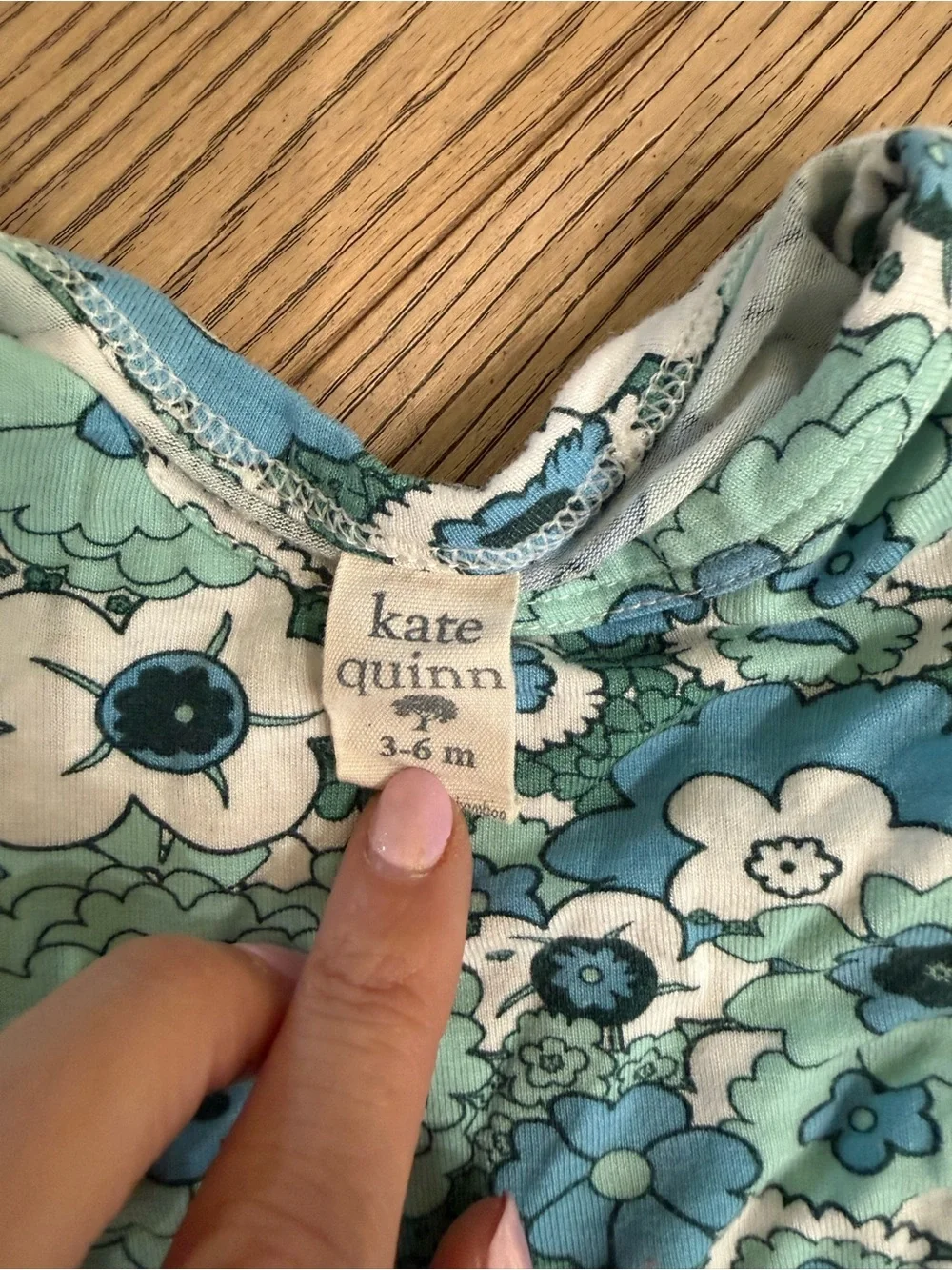 kate quinn Floral Baby Onesie in Aqua, Light Blue, and White